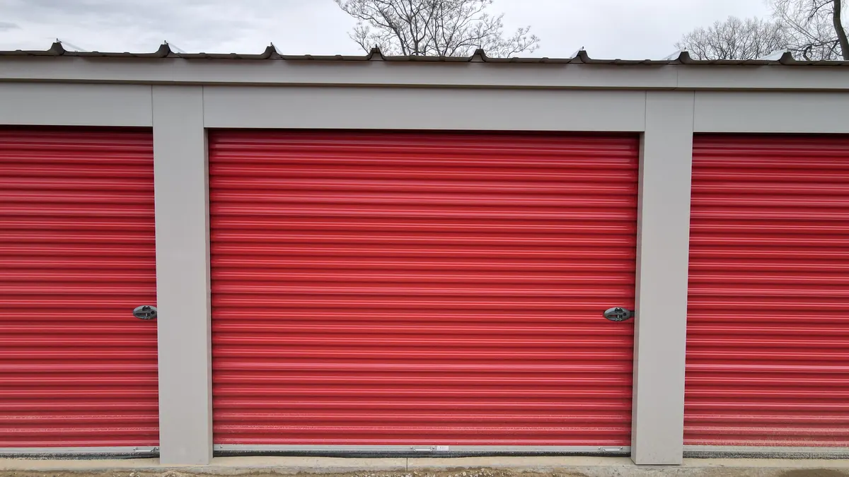 Close-up of red roll-up storage unit doors at Integrity Storage